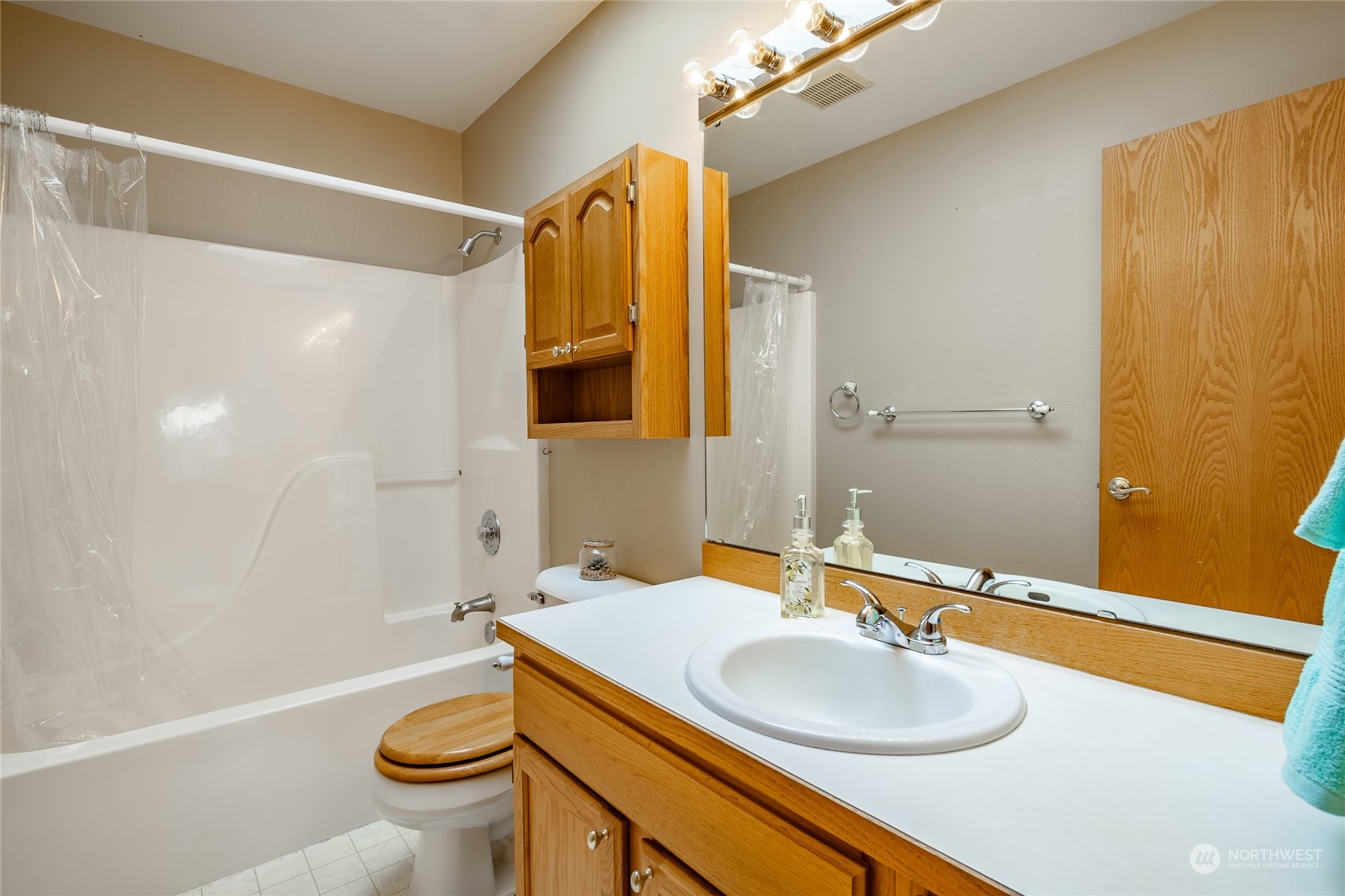 8087 Kispiox Road Blaine, WA 98230 - Photo 25 of 37 a bathroom with a sink and a mirror
