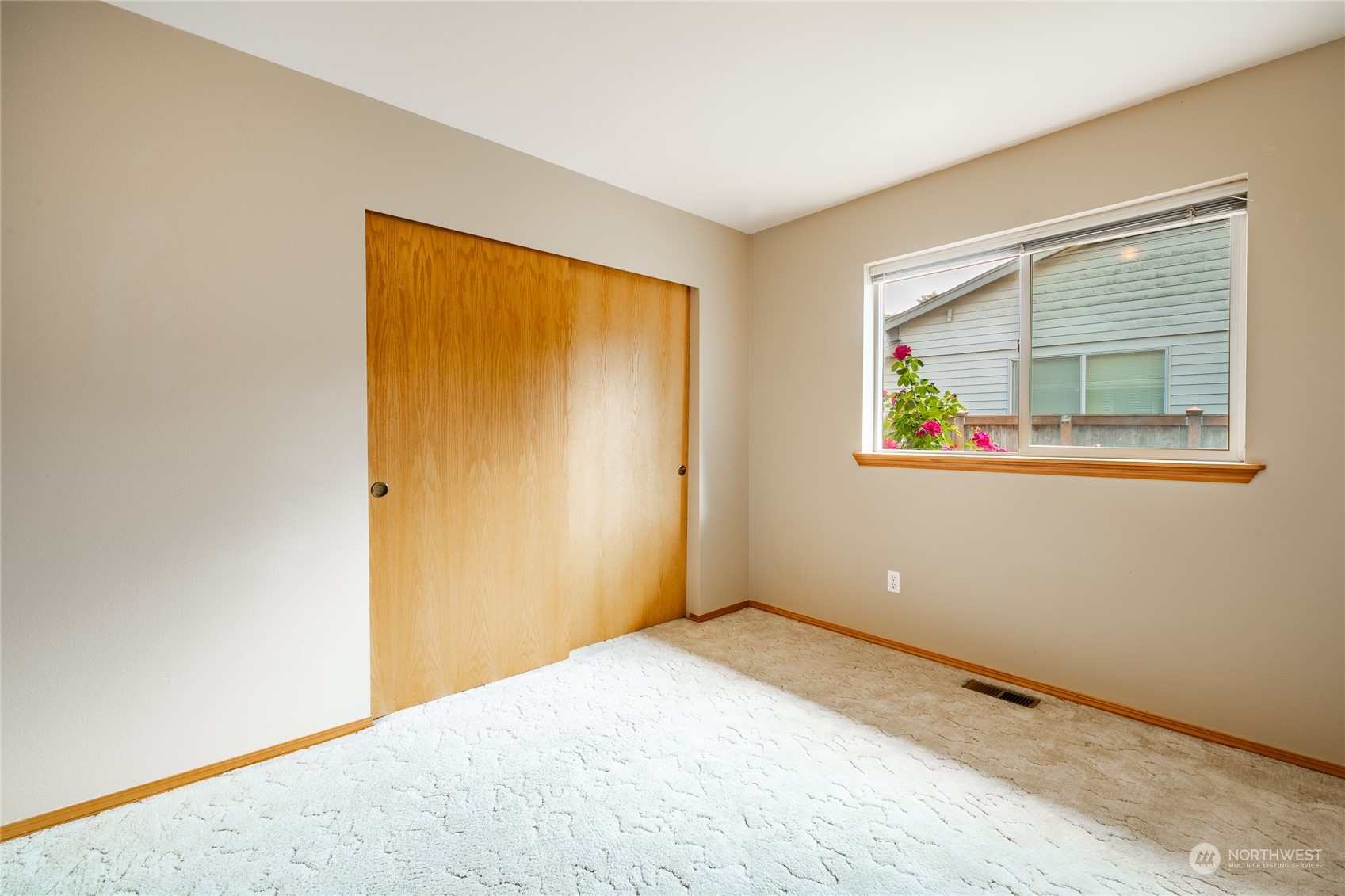 8087 Kispiox Road Blaine, WA 98230 - Photo 27 of 37 a view of an empty room with a window