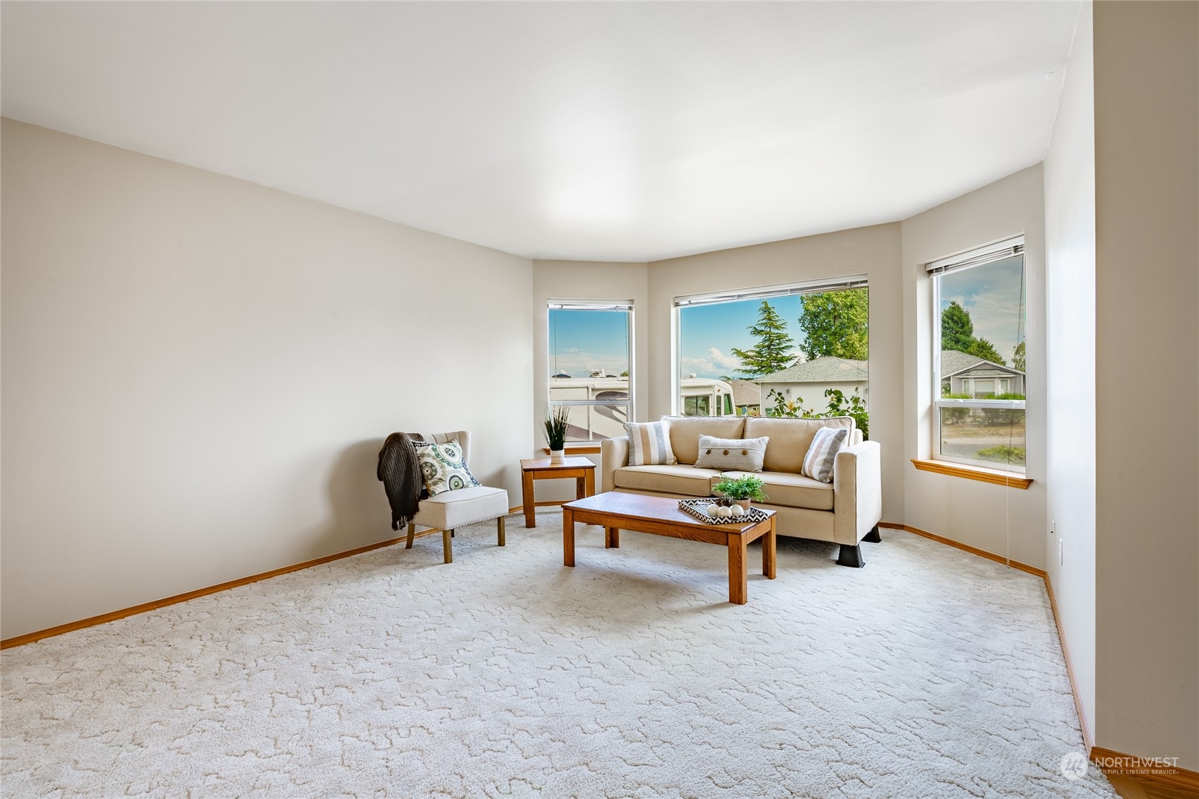 8087 Kispiox Road Blaine, WA 98230 - Photo 6 of 37 a living room with furniture and large windows
