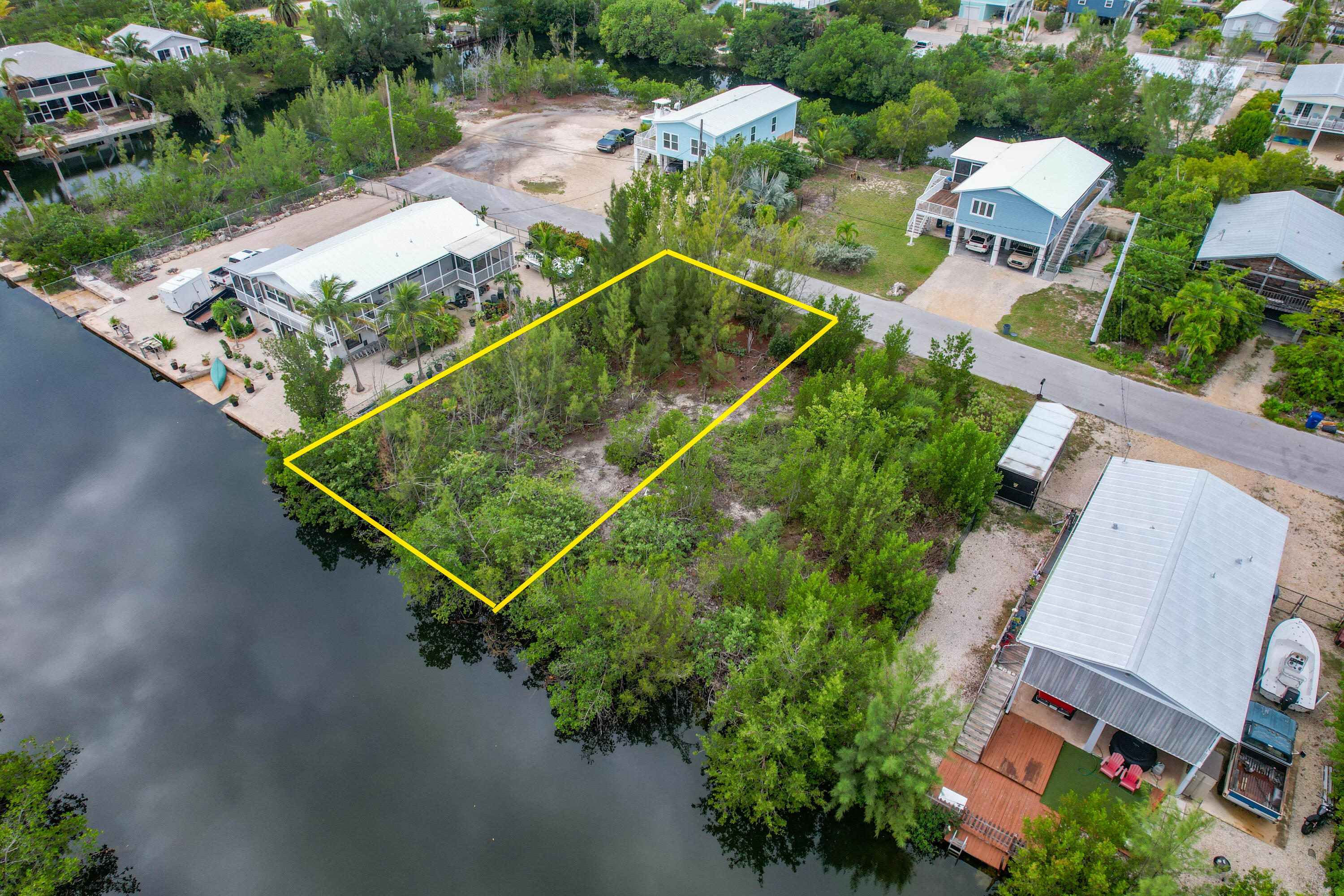 231 Pelican Lane Big Pine Key, FL 33043 - Photo 4 of 7 an aerial view of a house with a yard and outdoor seating