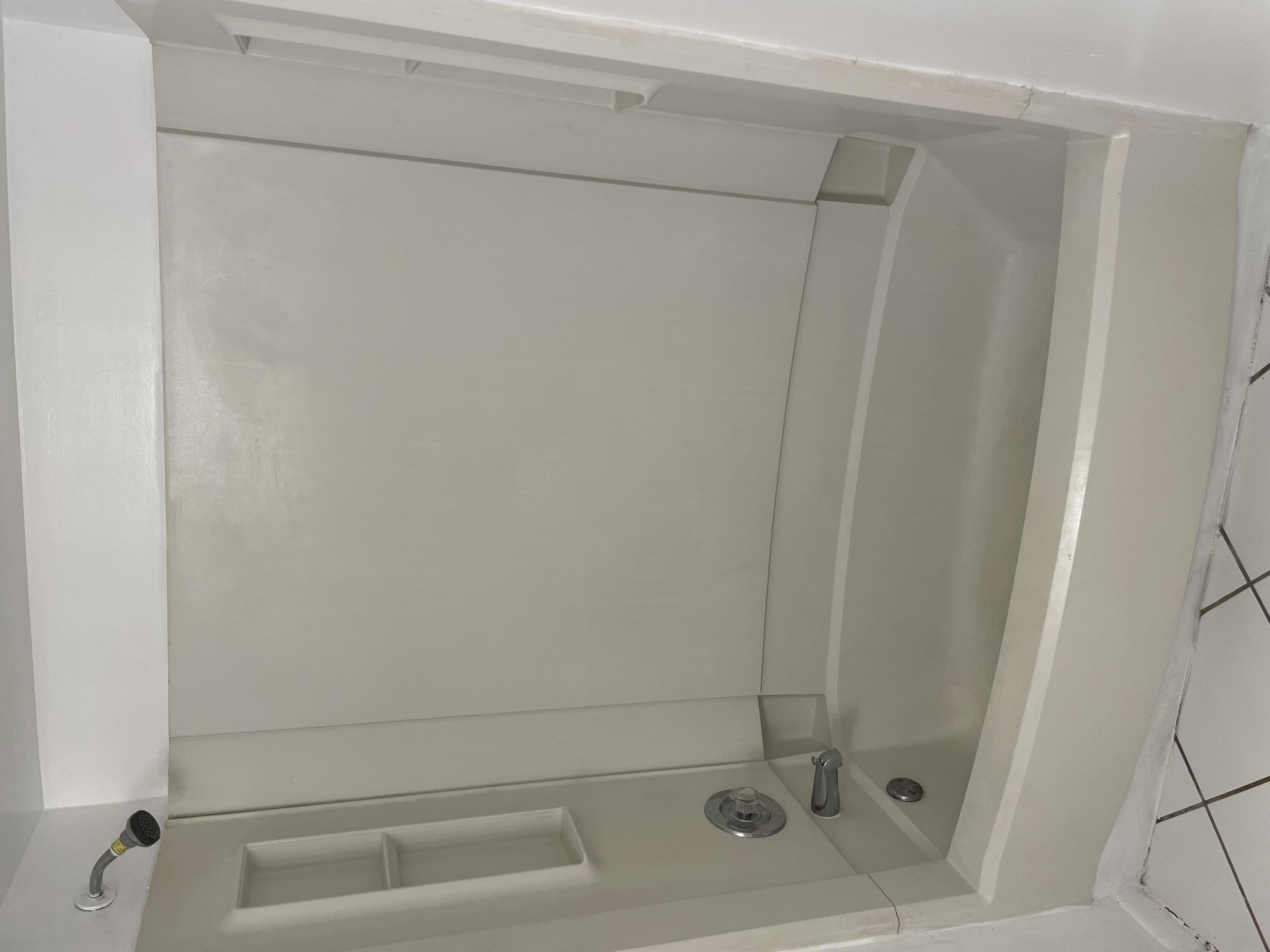 2771 Riverside Drive, Unit 113A Coral Springs, FL 33065 - Photo 4 of 8 a bathroom with a bathtub