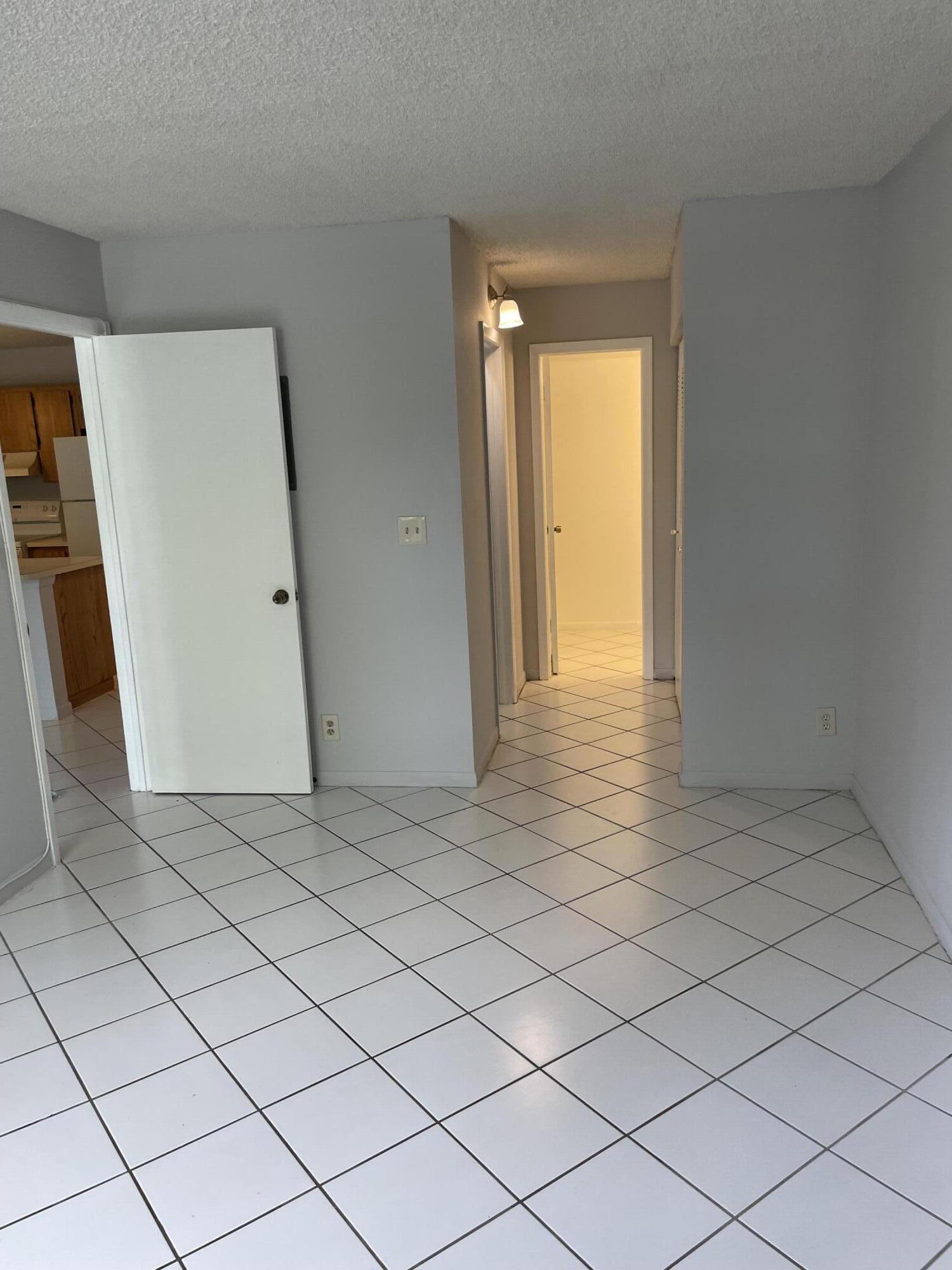 2771 Riverside Drive, Unit 113A Coral Springs, FL 33065 - Photo 5 of 8 a view of a room with window