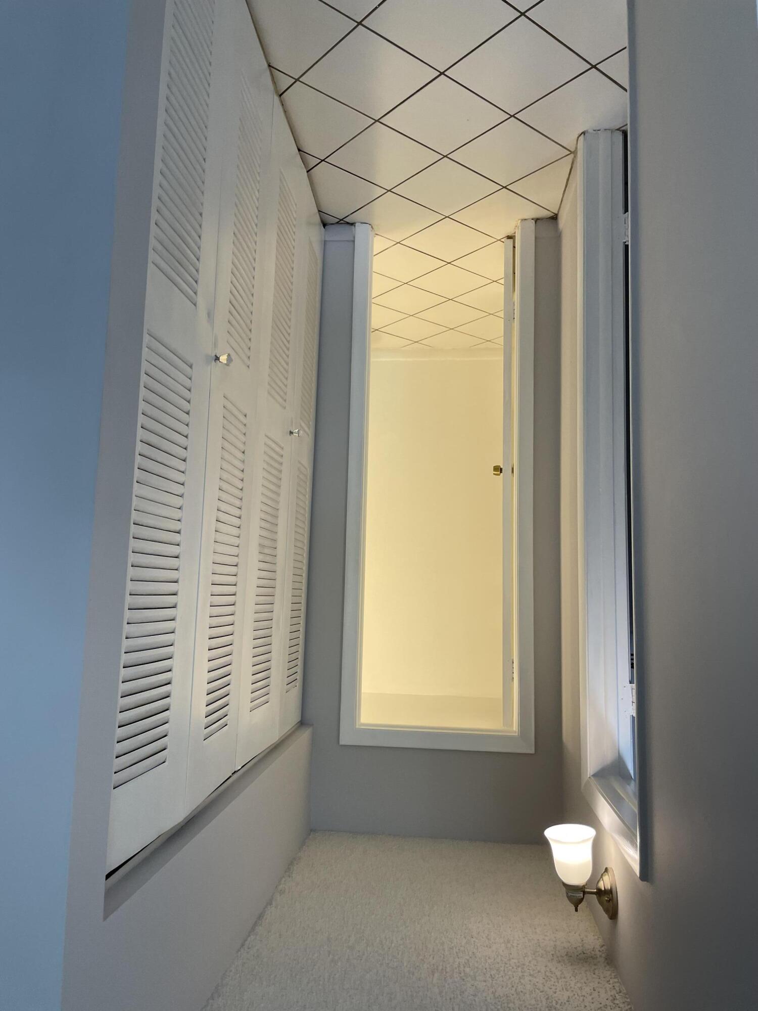 2771 Riverside Drive, Unit 113A Coral Springs, FL 33065 - Photo 7 of 8 a view of an empty room with a window