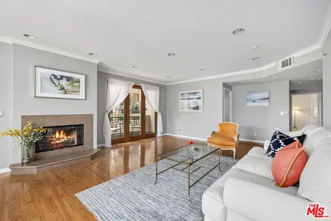 a bedroom with furniture and a fireplace