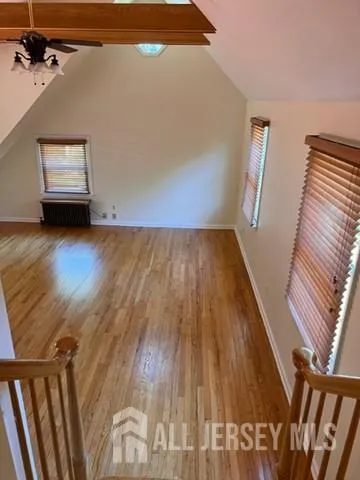 a view of a livingroom with wooden floor
