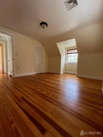 a view of a livingroom with wooden floor