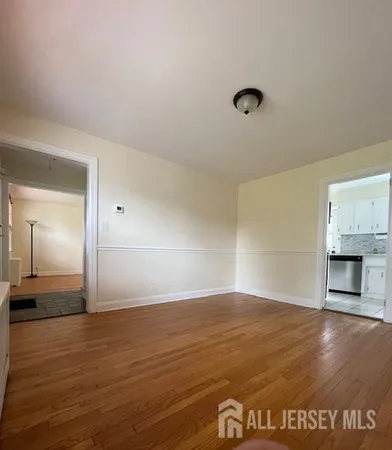 a view of empty room with window and fireplace