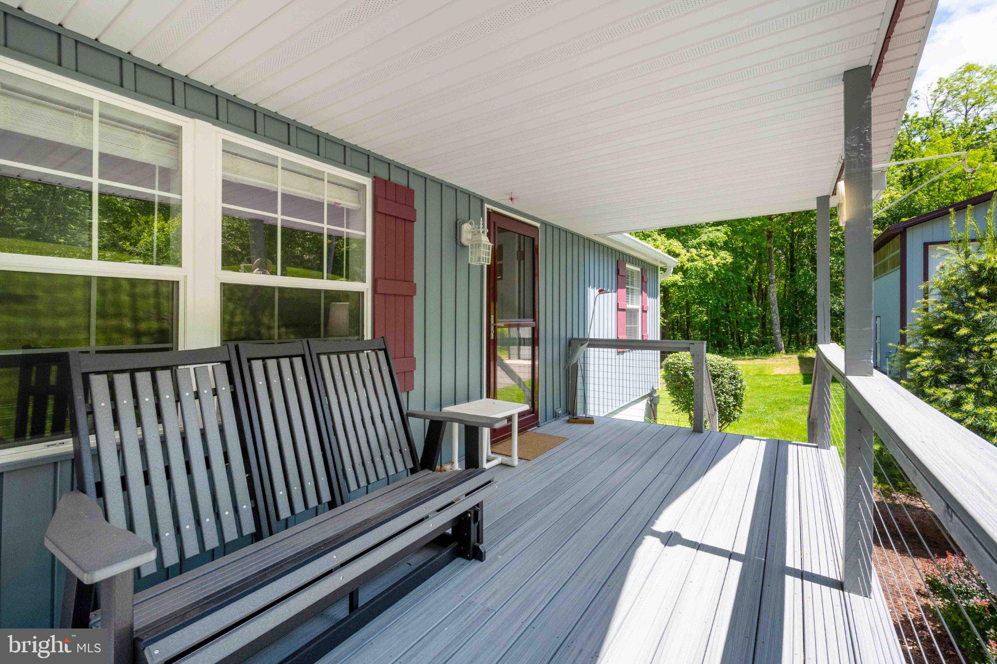 511 Hill Top Road Oakland, MD 21550 - Photo 5 of 51 Charming porch with serene views.