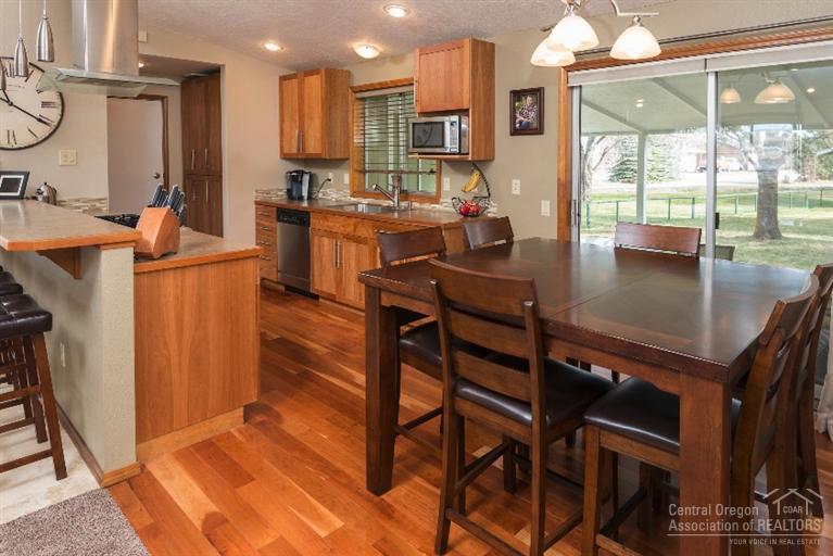 61850 Pettigrew Road Bend, OR 97702 - Photo 3 of 18 Dining and kitchen. True cherry hardwood