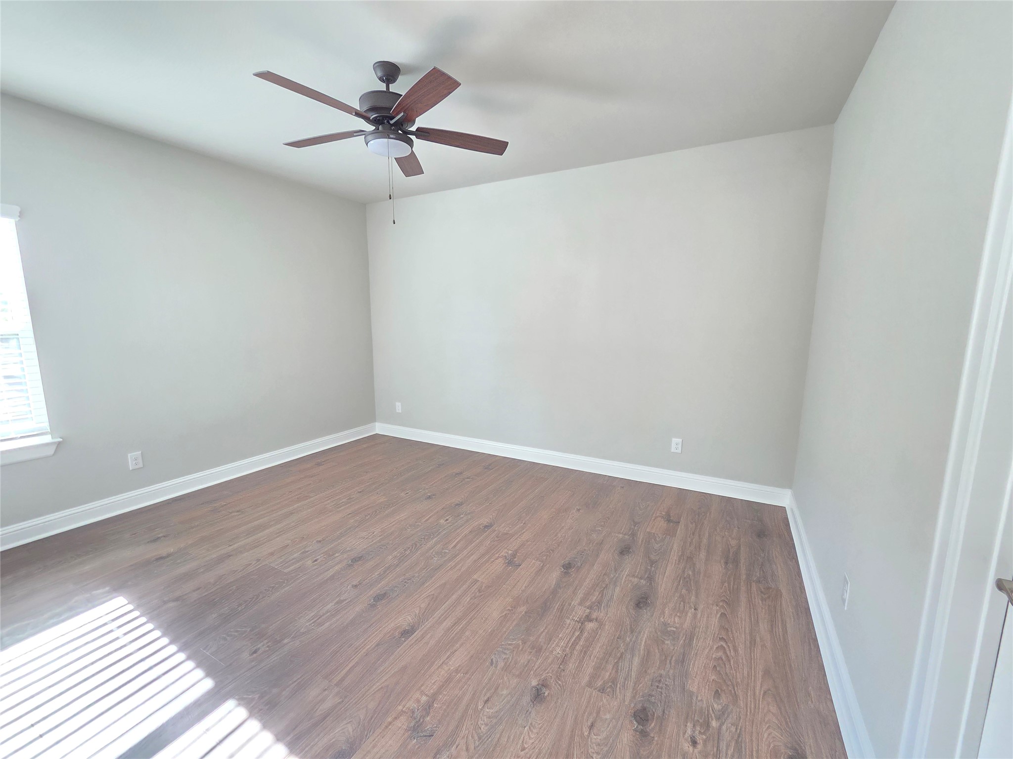 600 C-Bar Ranch Trail, Unit 121 Cedar Park, TX 78613 - Photo 27 of 32 A versatile space features rich wood-look flooring and a modern ceiling fan for comfort.