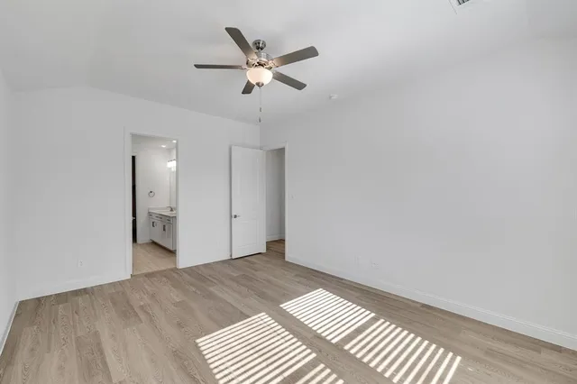 a view of a big room with wooden floor and closet