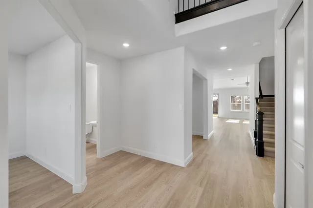 a view of a kitchen with wooden floor