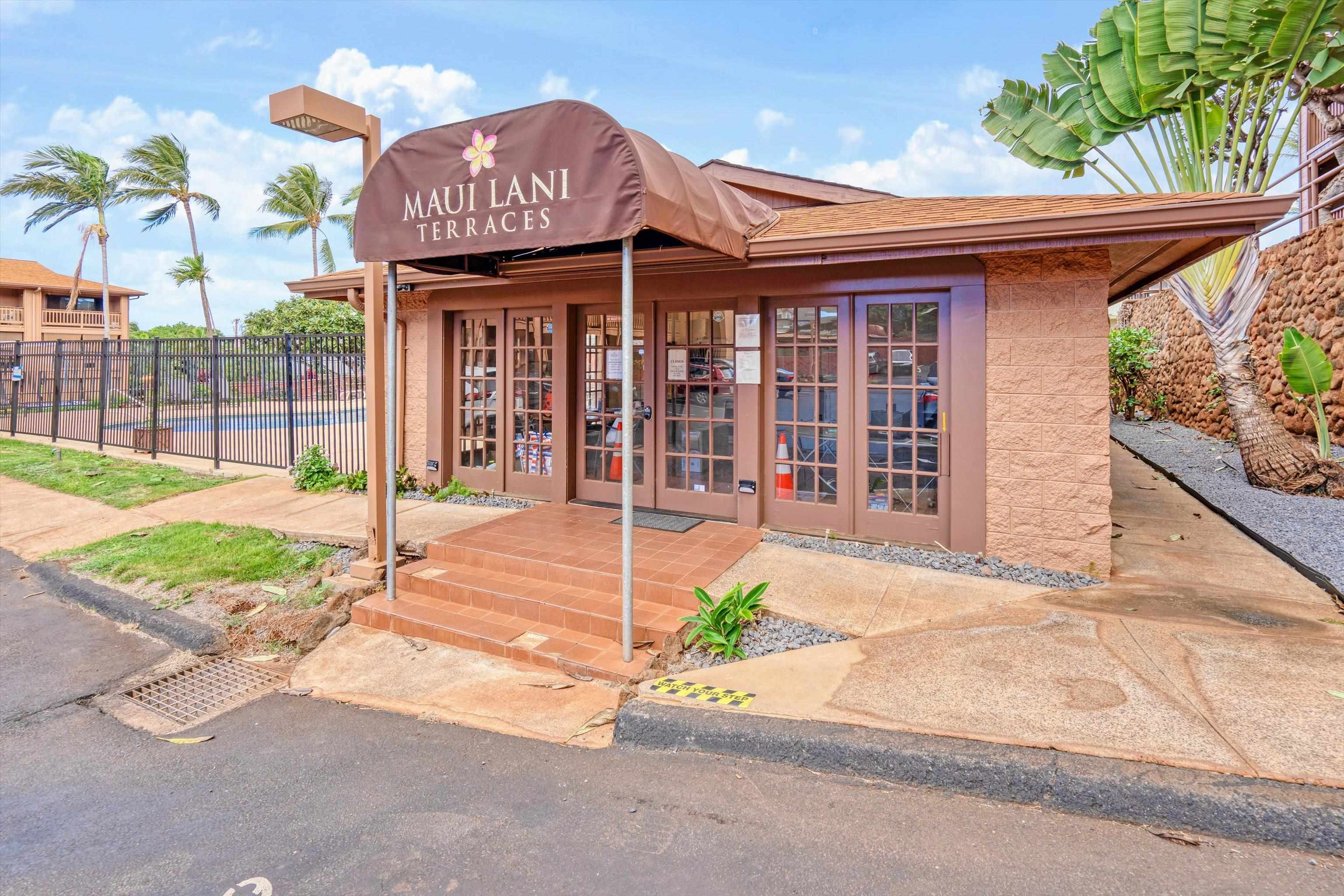 3740 Lower Honoapiilani Road, Unit C102 Lahaina, HI 96761 - Photo 29 of 50 a front view of a house with a garden and patio