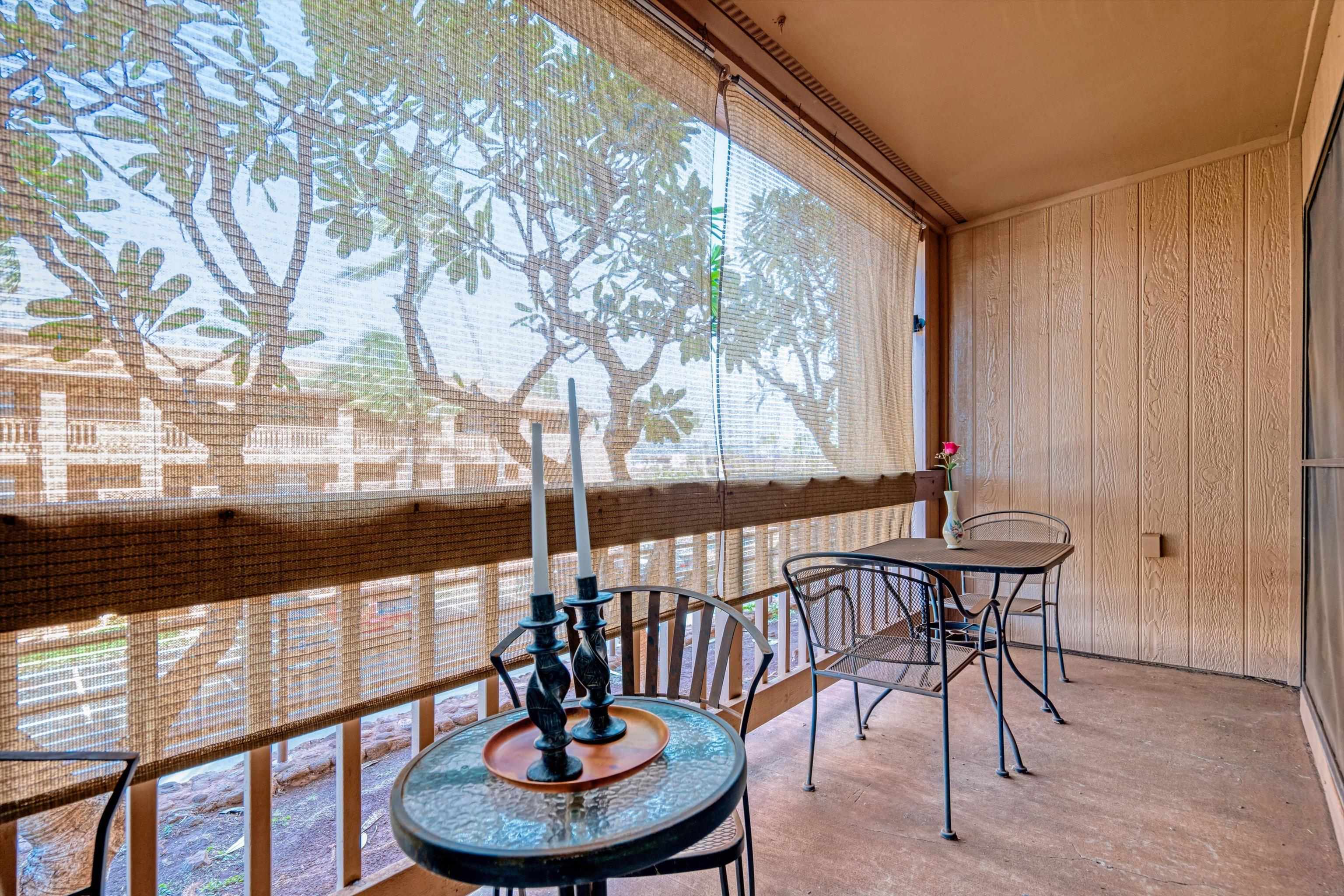 3740 Lower Honoapiilani Road, Unit C102 Lahaina, HI 96761 - Photo 3 of 50 a view of a porch with chairs and a yard