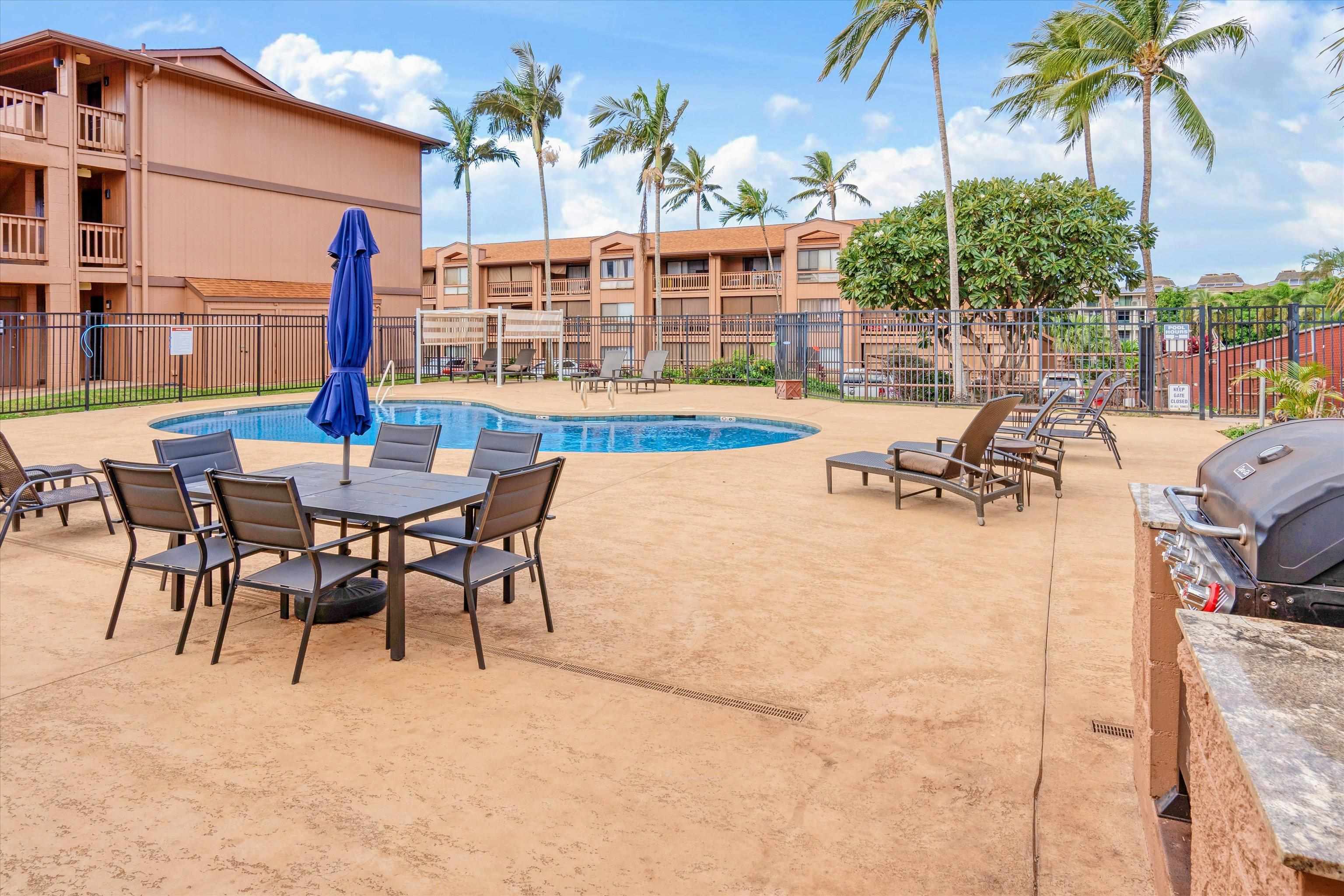 3740 Lower Honoapiilani Road, Unit C102 Lahaina, HI 96761 - Photo 32 of 50 a view of a patio with a table and chairs