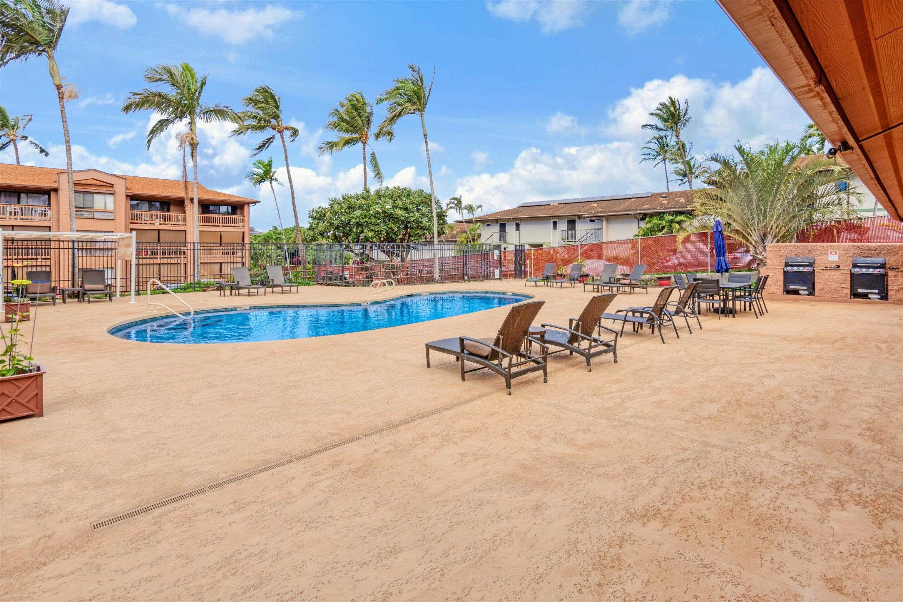 3740 Lower Honoapiilani Road, Unit C102 Lahaina, HI 96761 - Photo 33 of 50 an outdoor space with swimming pool and furniture