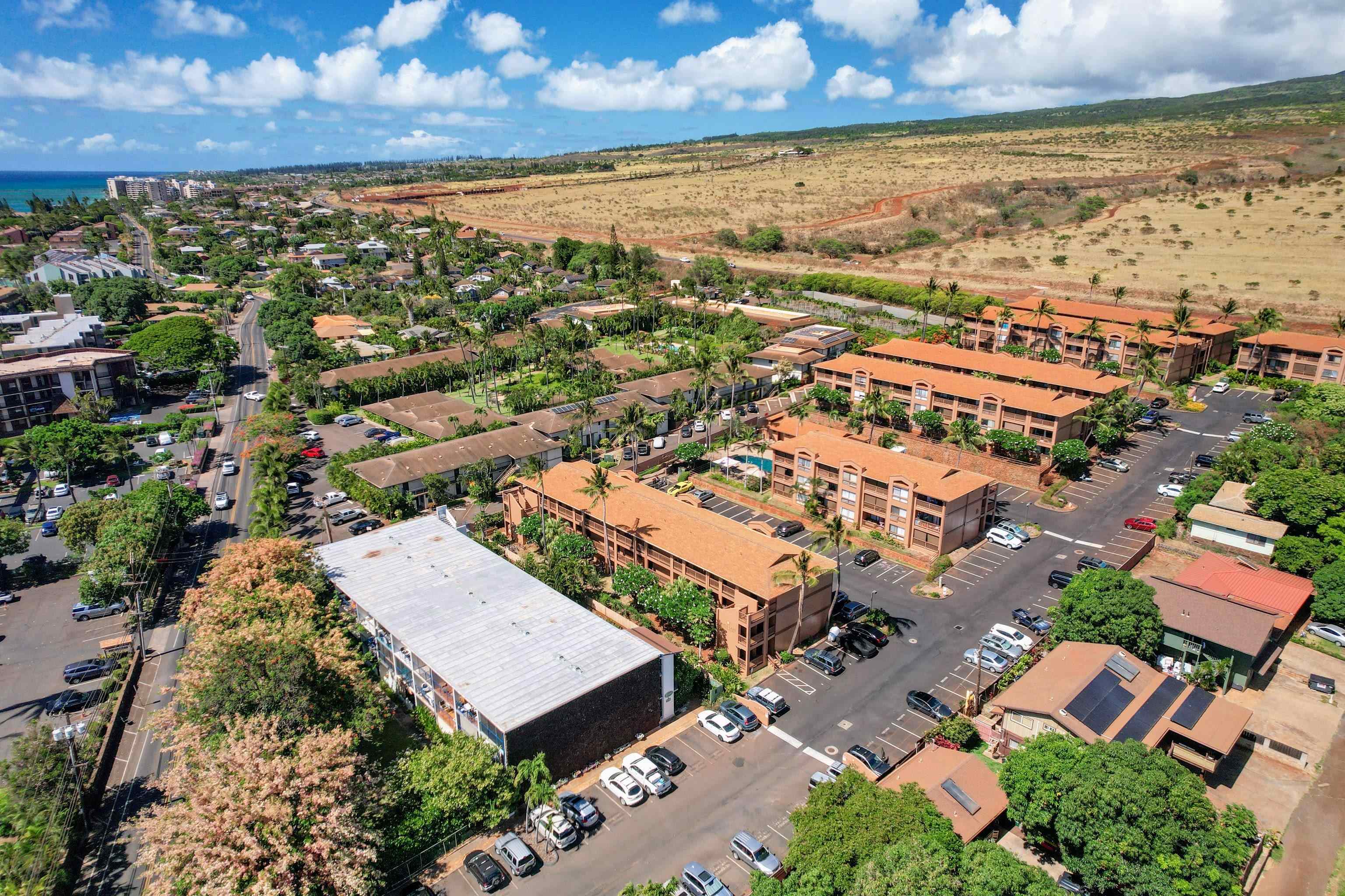 3740 Lower Honoapiilani Road, Unit C102 Lahaina, HI 96761 - Photo 39 of 50 an aerial view of residential houses with outdoor space