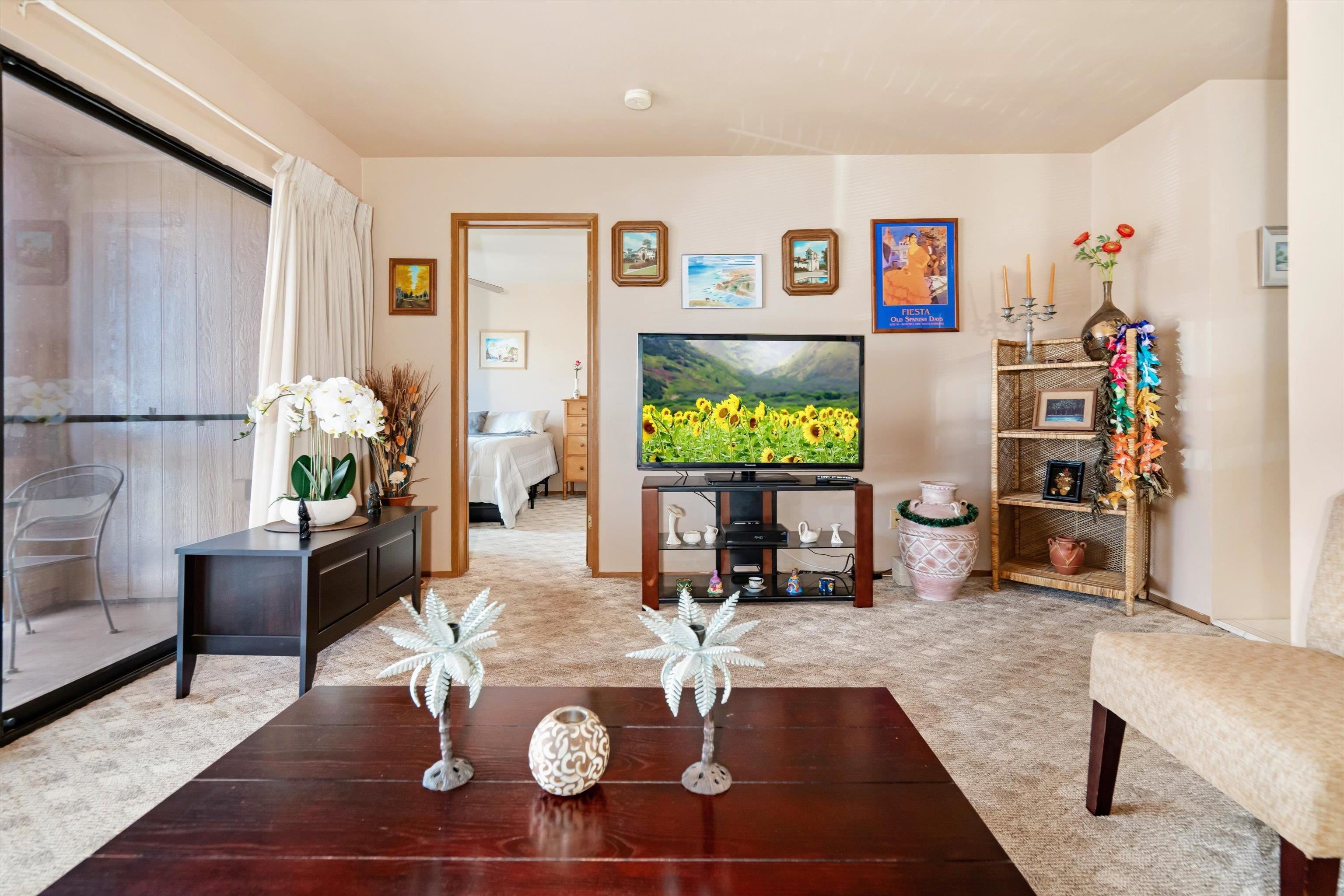 3740 Lower Honoapiilani Road, Unit C102 Lahaina, HI 96761 - Photo 6 of 50 a living room with furniture and a table