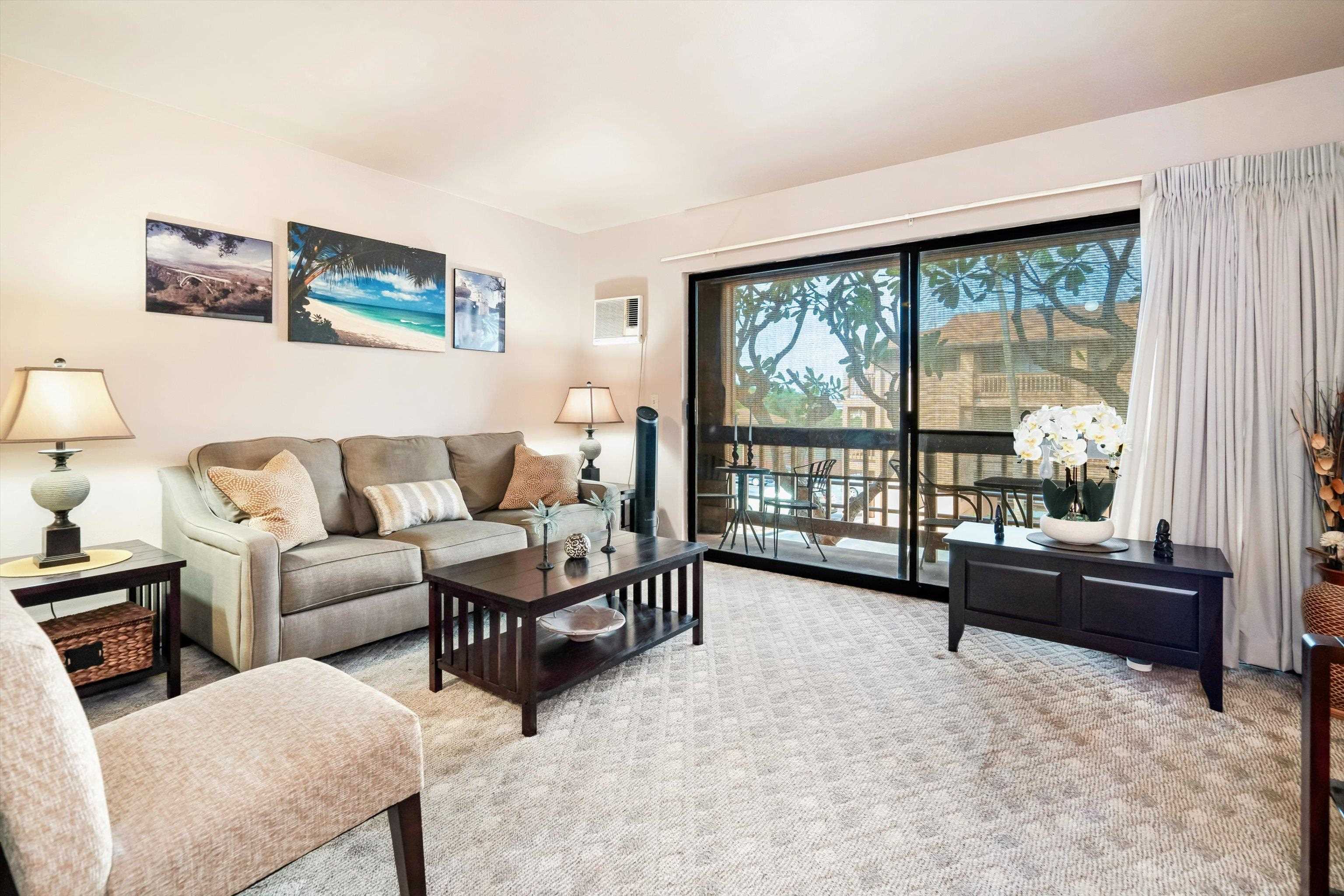 3740 Lower Honoapiilani Road, Unit C102 Lahaina, HI 96761 - Photo 7 of 50 a living room with furniture and a large window