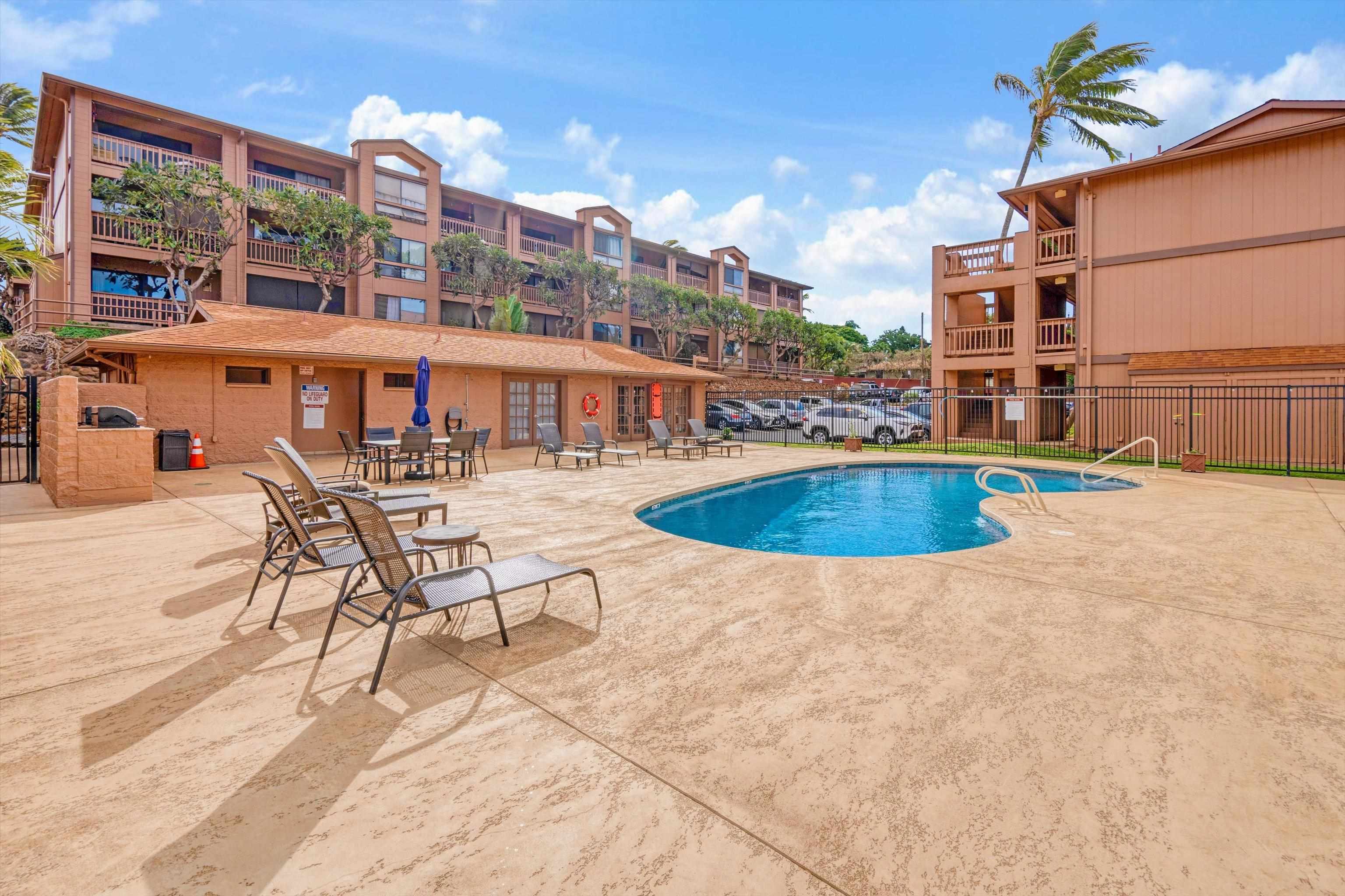 3740 Lower Honoapiilani Road, Unit C102 Lahaina, HI 96761 - Photo 10 of 50 a view of a swimming pool with outdoor seating