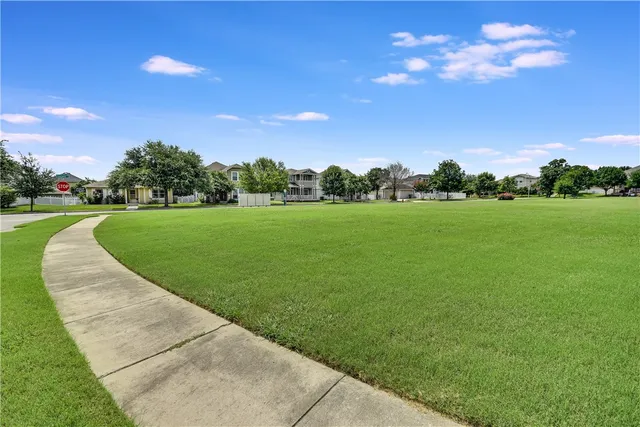 a view of a golf course with green space