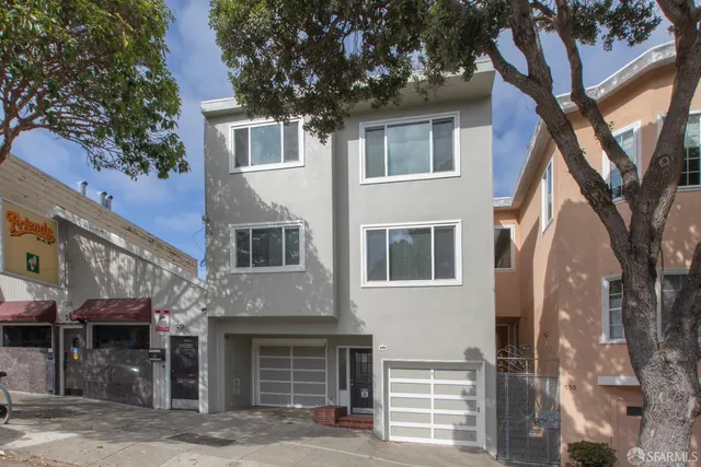 a front view of a house with parking