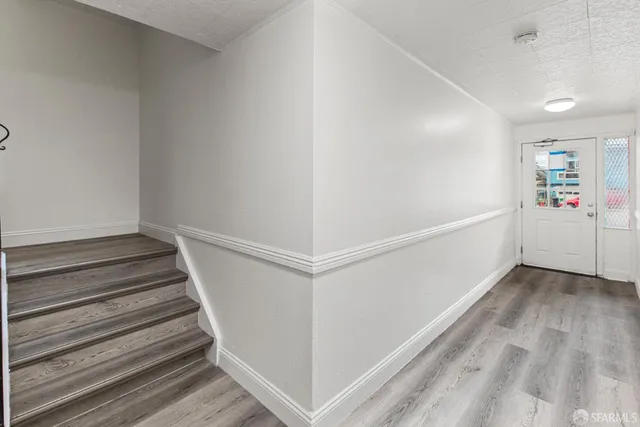 a view of a hallway with stairs