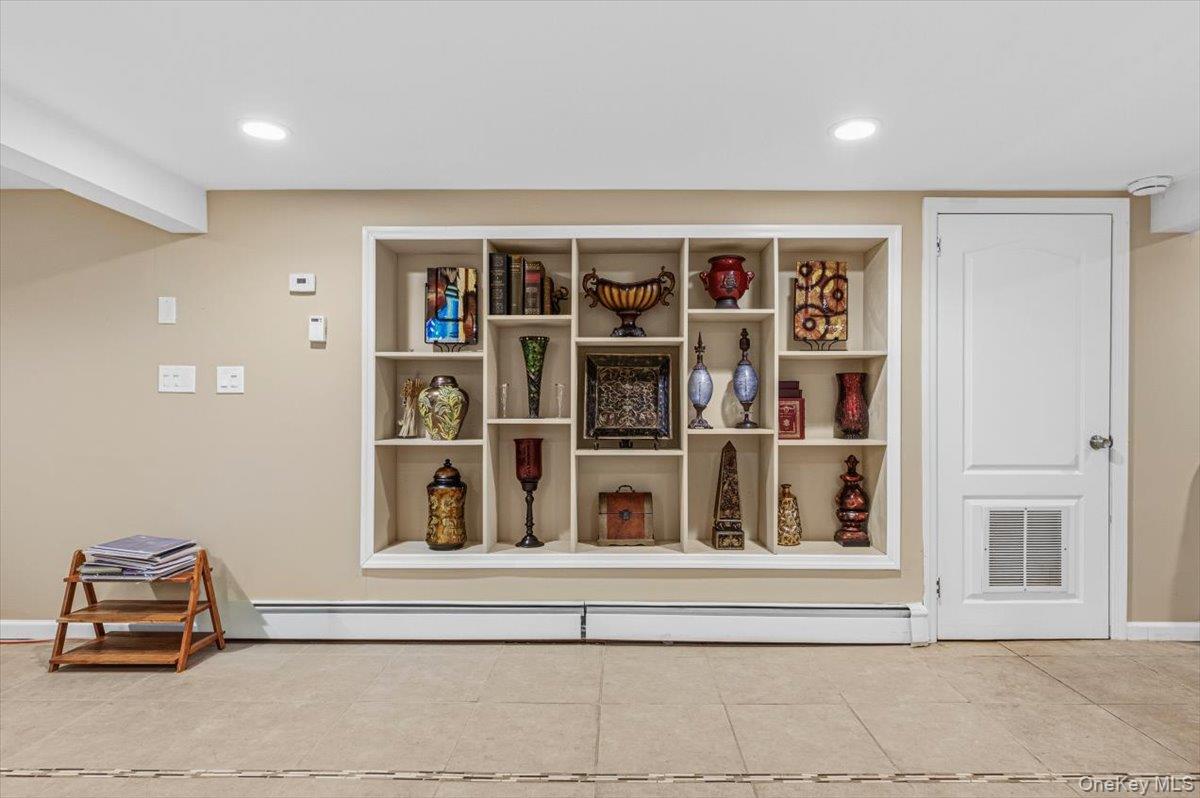 626 Caledonia Road Dix Hills, NY 11746 - Photo 11 of 49 a living room with closet