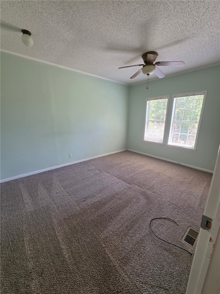 1400 Massey Road Pendleton, SC 29670 - Photo 21 of 25 This inviting space features comfortable carpeting and ample natural light, perfect for restful living.