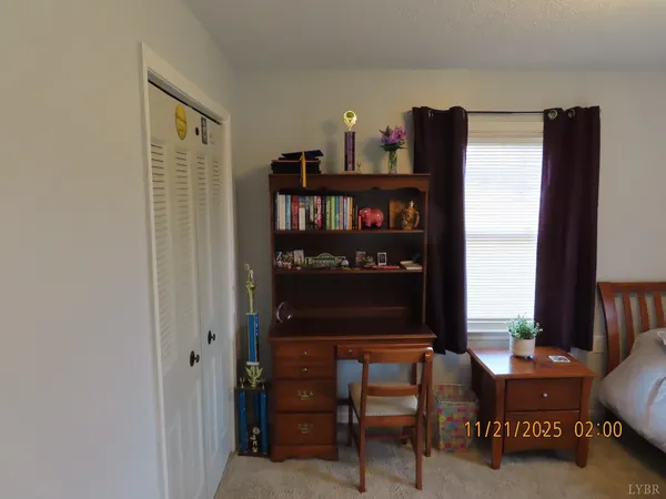 a room with a bed and a window