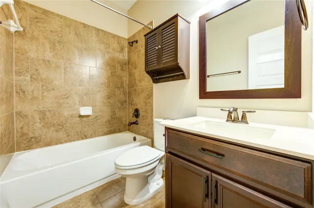 a bathroom with a sink a toilet and a bathtub
