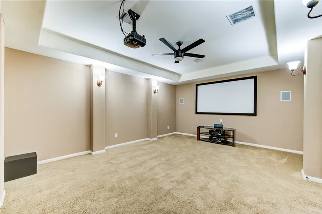 a view of game room with windows