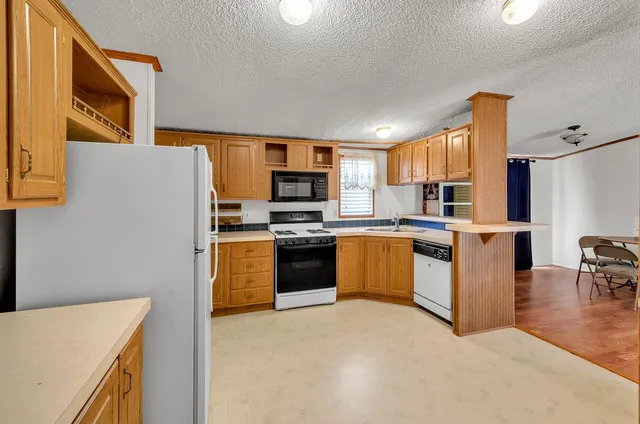 a very nice looking living room with a large window