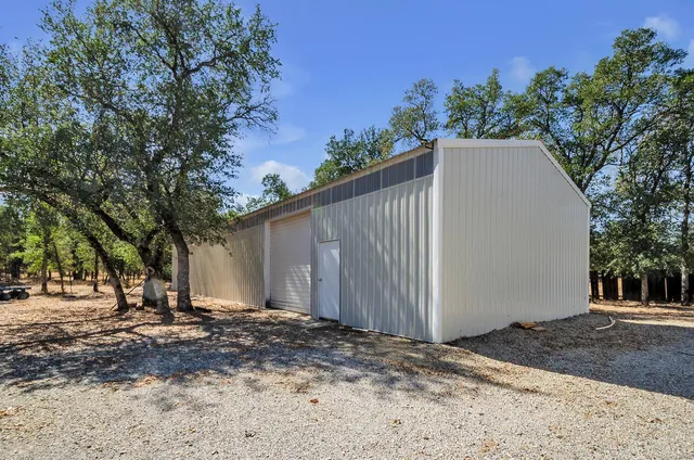 a bed room with furniture and a fireplace