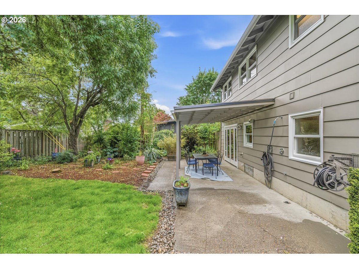 3130 Southwest 116th Avenue Beaverton, OR 97005 - Photo 37 of 44 a backyard of a house with table and chairs