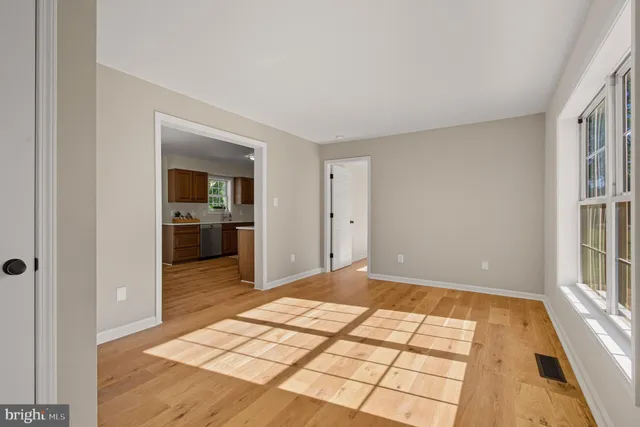 a view of a livingroom with a kitchen space
