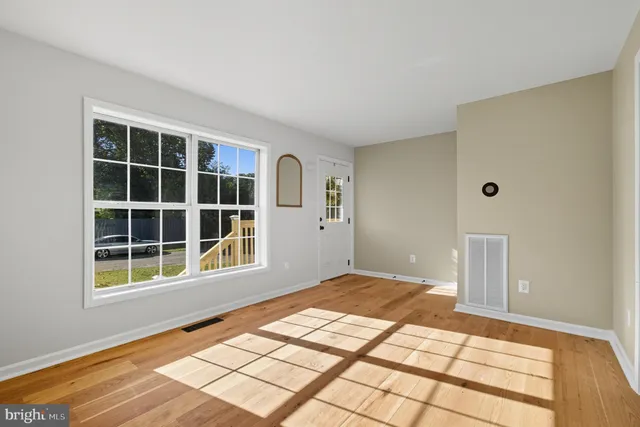 a view of empty room with windows