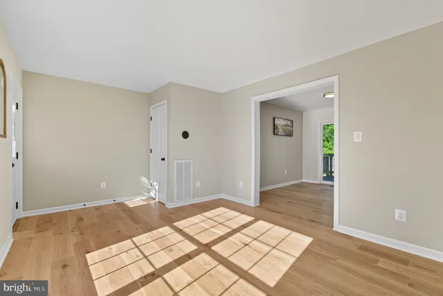 a kitchen with a refrigerator and a stove top oven