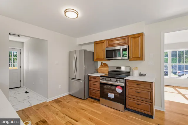 a spacious bathroom with a sink and a mirror