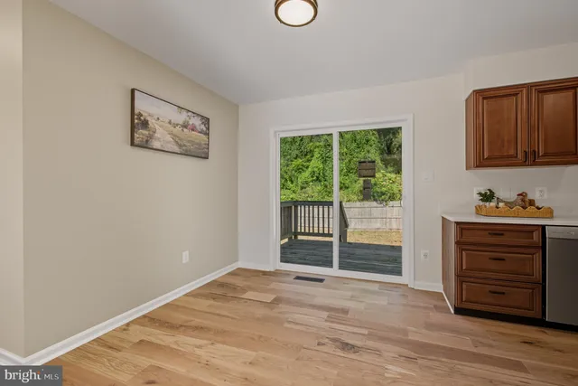 a view of a kitchen with furniture and window