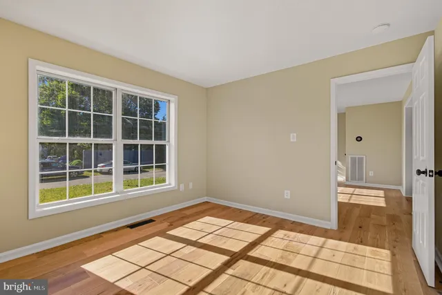 a bathroom with a shower a sink and a toilet