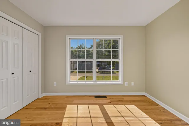 a view of balcony with wooden floor and fence