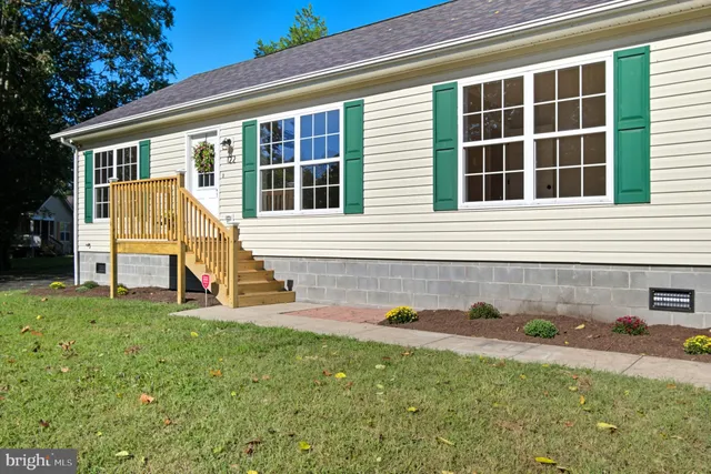 a view of backyard with a garden and deck