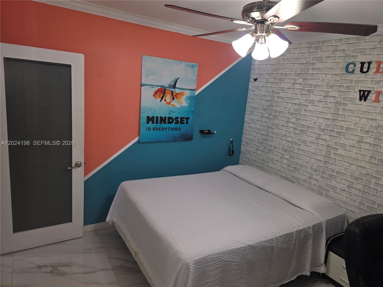651 East 48th Street Hialeah, FL 33013 - Photo 9 of 52 a bed sitting in a bathroom next to a wall