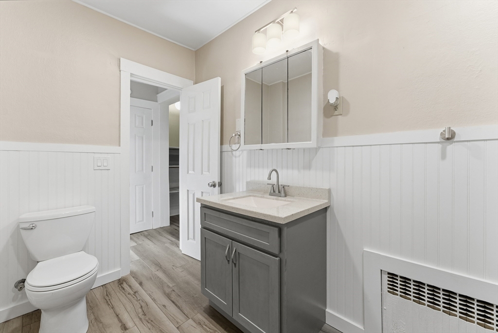 74-76 Maple Terrace West Springfield, MA 01089 - Photo 11 of 39 a bathroom with a sink toilet and a mirror