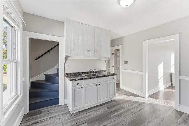 a kitchen with granite countertop a stove and a refrigerator