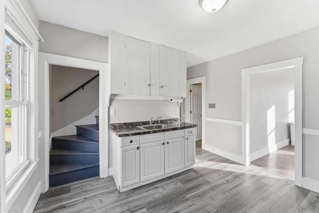 74-76 Maple Terrace West Springfield, MA 01089 - Photo 13 of 39 a kitchen with granite countertop a stove and a refrigerator