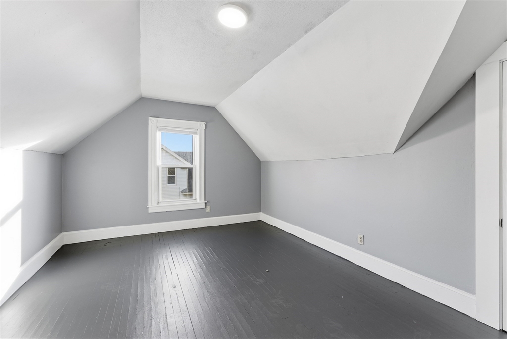74-76 Maple Terrace West Springfield, MA 01089 - Photo 19 of 39 an empty room with wooden floor and windows