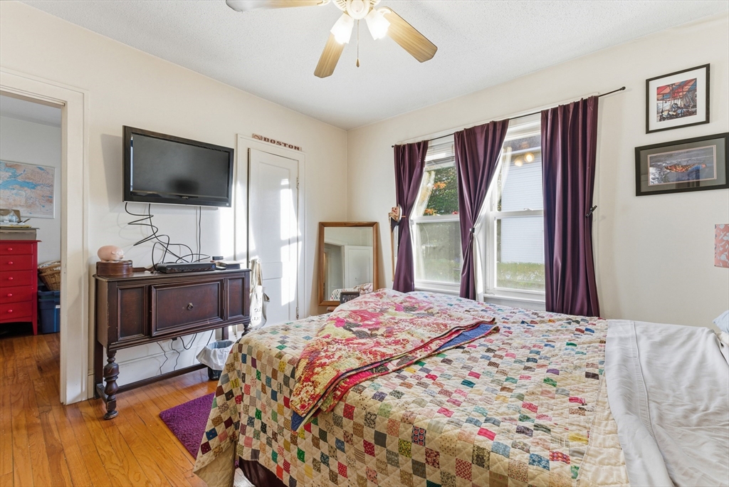 74-76 Maple Terrace West Springfield, MA 01089 - Photo 27 of 39 a bedroom with a bed and a flat screen tv