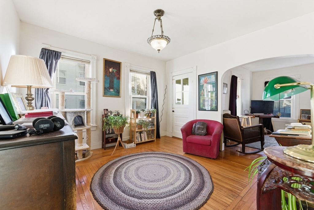 74-76 Maple Terrace West Springfield, MA 01089 - Photo 31 of 39 a living room with furniture and a chandelier
